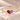 Demi Heart Bracelet in gold with January garnet and February amethyst pear-cut stones forming a heart