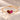 Demi Heart Bracelet in gold with January garnet and July ruby pear-cut stones forming a heart