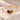 Demi Heart Bracelet in gold with January garnet and August peridot pear-cut stones forming a heart
