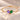 Demi Heart Bracelet in gold with February amethyst and May emerald pear-cut stones forming a heart