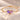 Demi Heart Bracelet in gold with February amethyst and October pink tourmaline pear-cut stones forming a heart