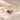 Demi Heart Bracelet in gold with May emerald and February amethyst pear-cut stones forming a heart