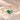 Demi Heart Bracelet in gold with May emerald and March aquamarine pear-cut stones forming a heart