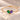Demi Heart Bracelet in gold with May emerald and June alexandrite pear-cut stones forming a heart