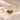 Demi Heart Bracelet in gold with May emerald and August peridot pear-cut stones forming a heart