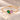 Demi Heart Bracelet in gold with May emerald and October pink tourmaline pear-cut stones forming a heart