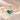 Demi Heart Bracelet in gold with May emerald and December zircon pear-cut stones forming a heart