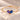 Demi Heart Bracelet in gold with June alexandrite and September sapphire pear-cut stones forming a heart
