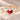Demi Heart Bracelet in gold with July ruby and January garnet pear-cut stones forming a heart