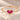 Demi Heart Bracelet in gold with two July ruby pear-cut stones forming a heart