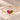 Demi Heart Bracelet in gold with July ruby and August peridot pear-cut stones forming a heart