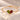 Demi Heart Bracelet in gold with August peridot and January garnet pear-cut stones forming a heart