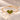 Demi Heart Bracelet in gold with two August peridot pear-cut stones forming a heart