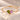 Demi Heart Bracelet in gold with August peridot and October pink tourmaline pear-cut stones forming a heart