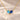 Demi Heart Necklace in gold with March aquamarine and September sapphire pear-cut stones forming a heart