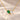 Demi Heart Necklace in gold with May emerald and April diamond pear-cut stones forming a heart