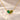 Demi Heart Necklace in gold with May emerald and August peridot pear-cut stones forming a heart