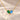 Demi Heart Necklace in gold with May emerald and December zircon pear-cut stones forming a heart