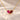 Demi Heart Necklace in gold with July ruby and January garnet pear-cut stones forming a heart