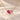 Demi Heart Necklace in gold with July ruby and October pink tourmaline pear-cut stones forming a heart