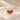 Demi Heart Necklace in gold with August peridot and July ruby pear-cut stones forming a heart