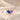 Demi Heart Necklace in gold with September sapphire and February amethyst pear-cut stones forming a heart