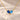 Demi Heart Necklace in gold with September sapphire and December zircon pear-cut stones forming a heart