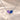 Demi Heart Necklace in silver with February amethyst and September sapphire pear-cut stones forming a heart