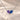 Demi Heart Necklace in silver with June alexandrite and September sapphire pear-cut stones forming a heart
