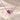 Demi Heart Necklace in silver with July ruby and October pink tourmaline pear-cut stones forming a heart